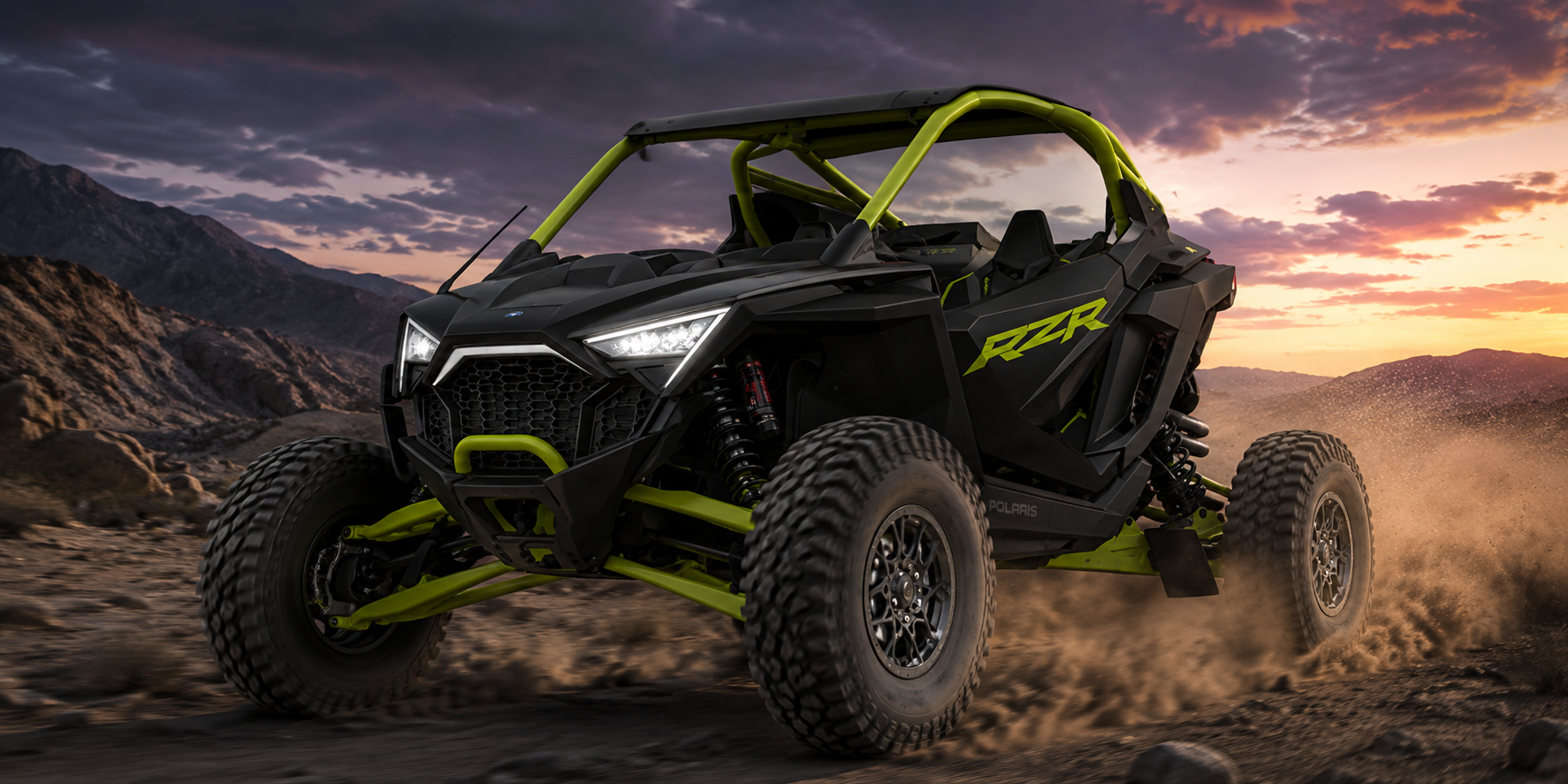 Polaris RZR Pro R style side-by-side driving through rugged desert terrain with upgraded tires, lighting, suspension, and Elite Offroad styling